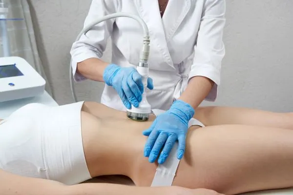 Lost the Weight but Not the Loose Skin? 2 woman having HIFU treatment on her stomach to combat loose skin Bispham following weight loss